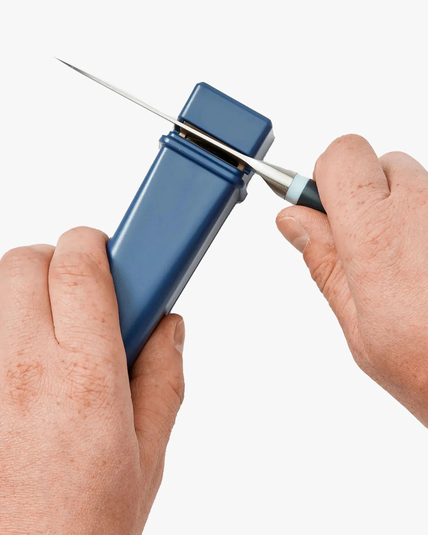 man sharpening knife with material knife sharpener in blue
