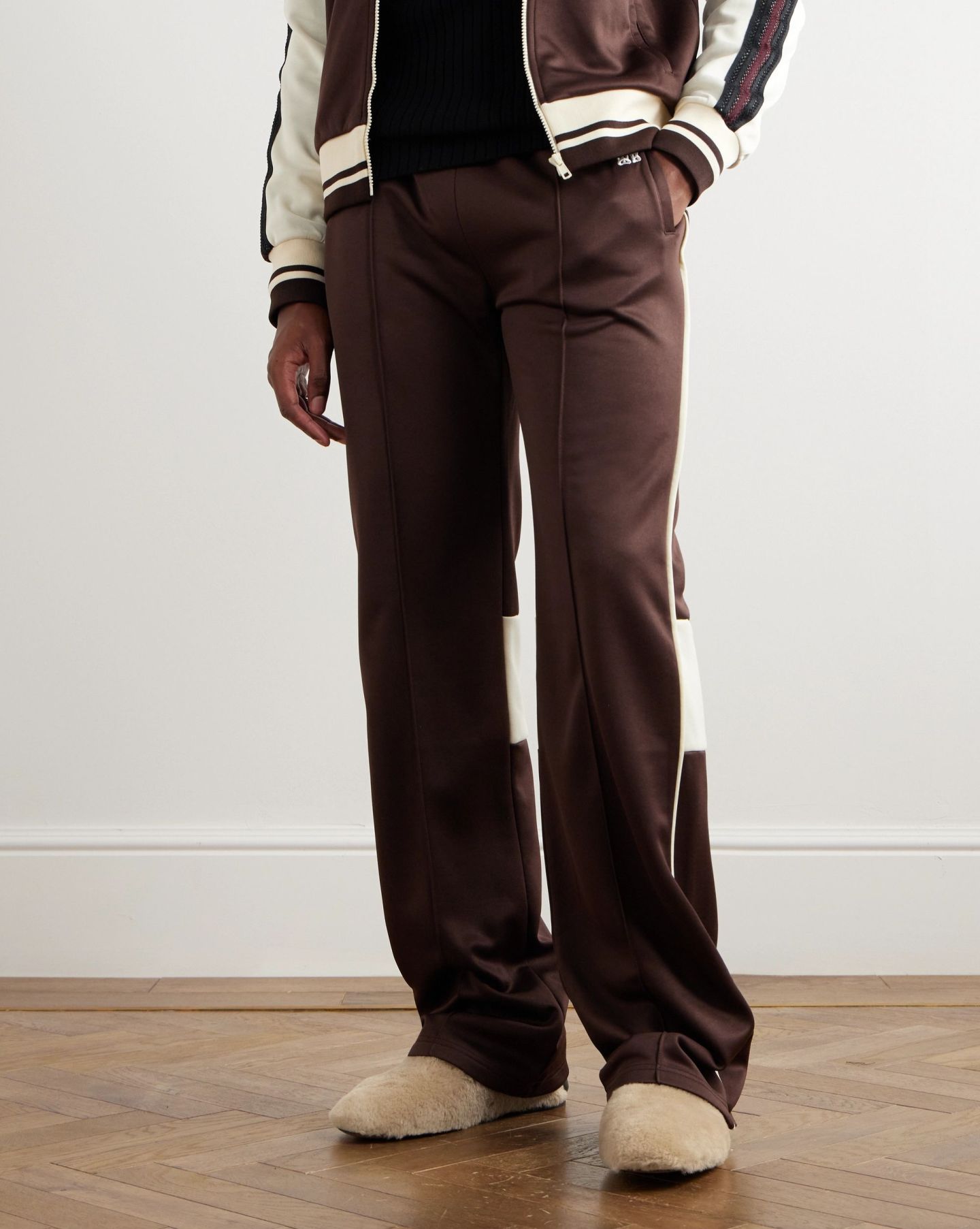 man wearing wales bonner leather trimmed shearling collapsible heel loafers