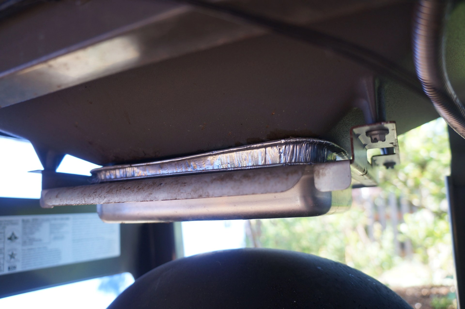 the weber spirit drip tray holder showing visible rust