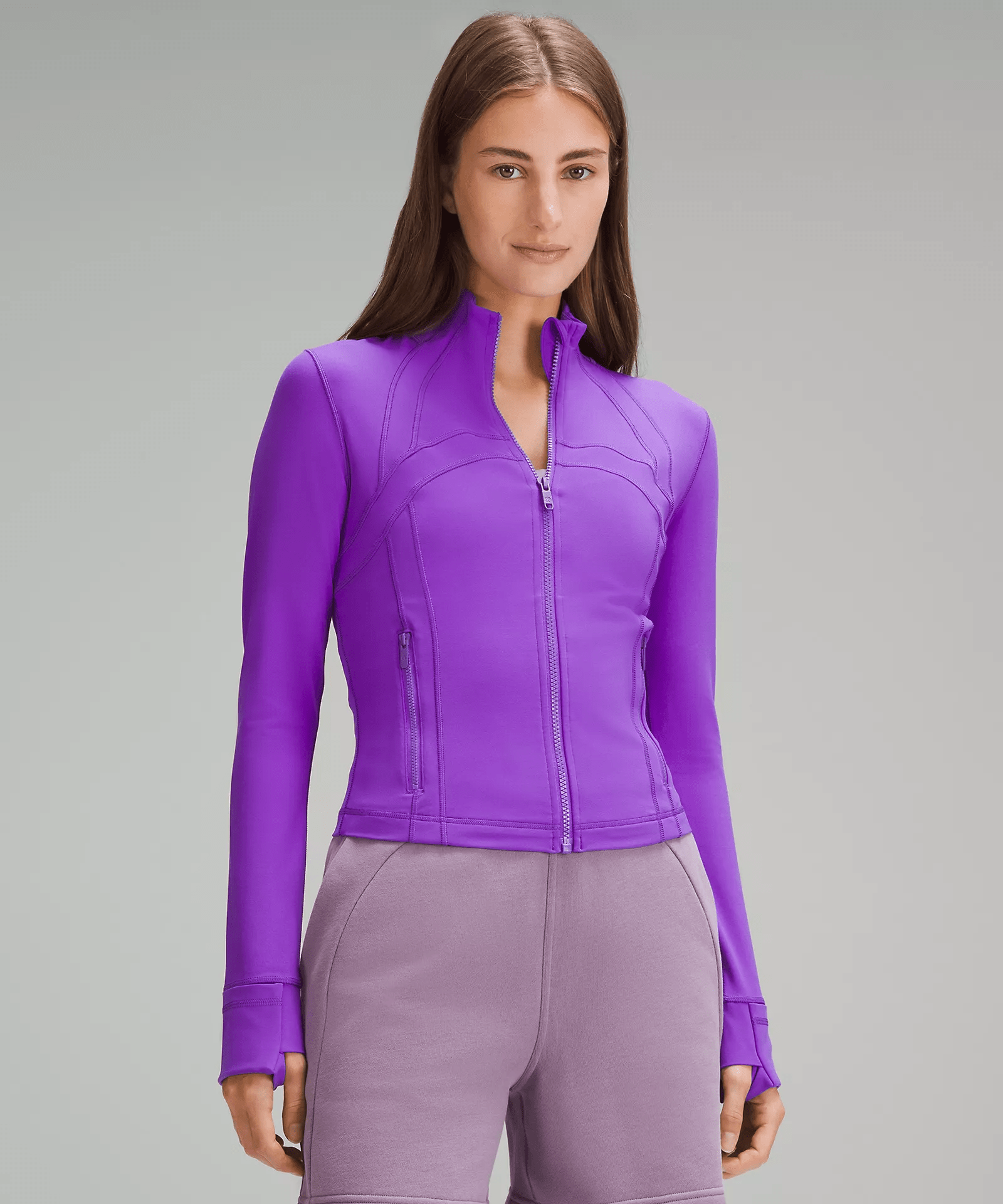 a woman wearing a purple sweater