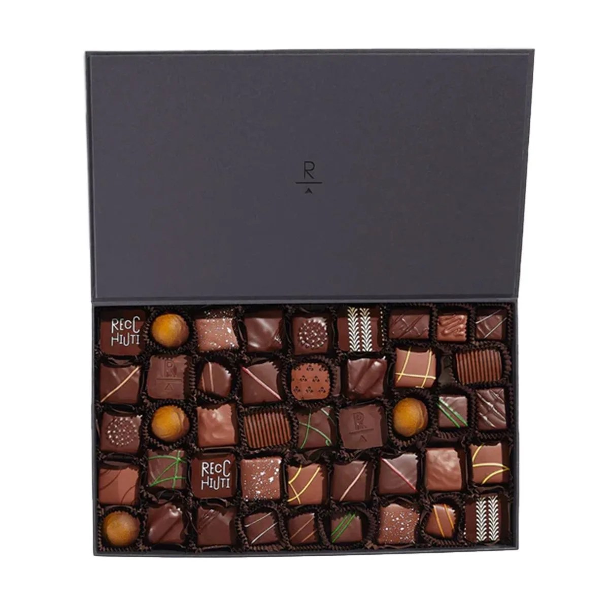 a black rectangular box with a group of coins inside