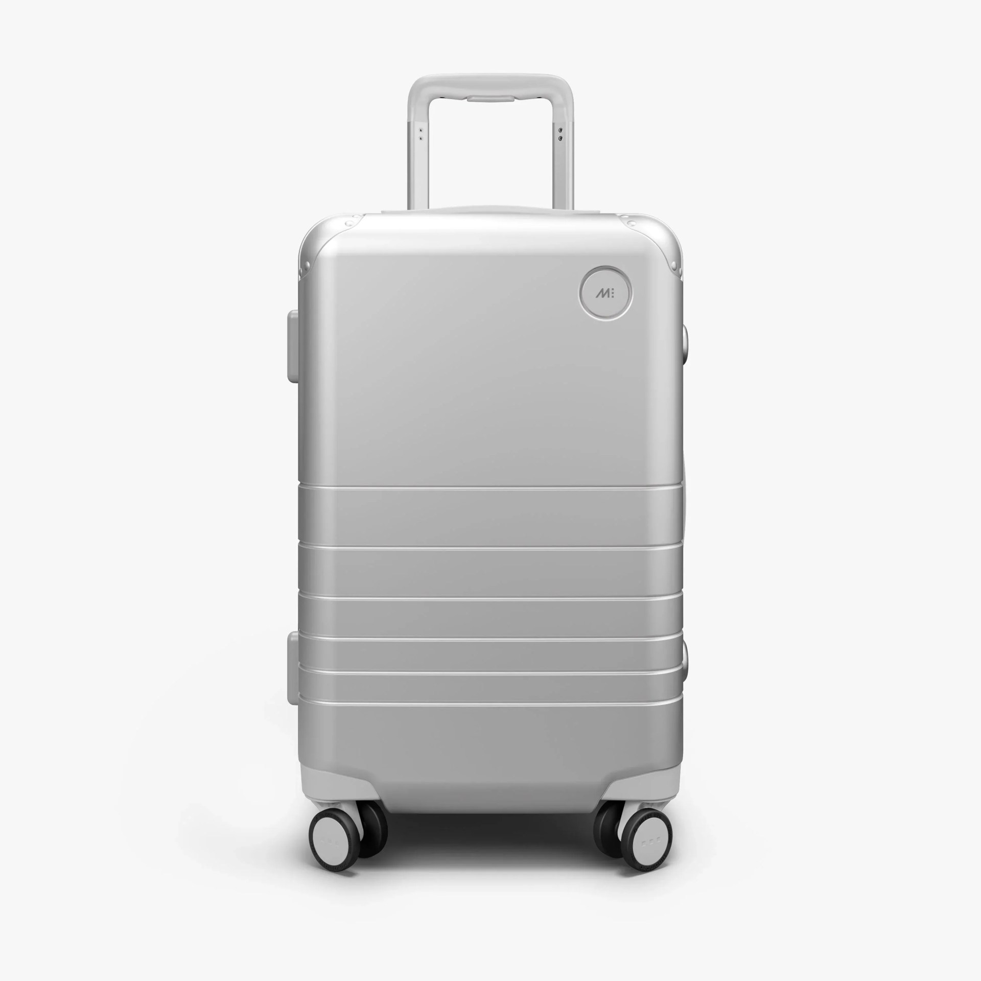 Monos Carry-On Hybrid Aluminum suitcase standing on ground with white background