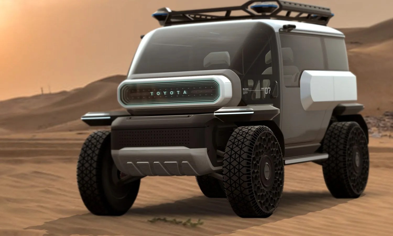 a toyota suv concept driving on a sandy road