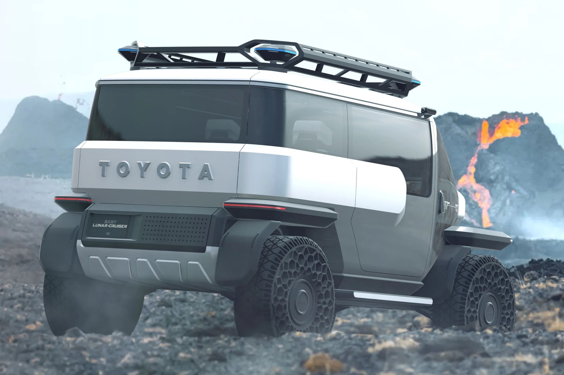 a white toyota concept with a fire in the back