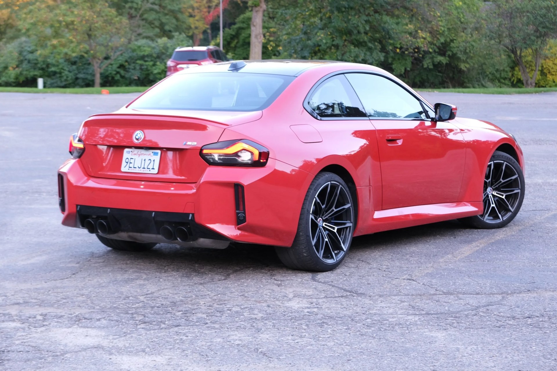 a red car parked on pavement