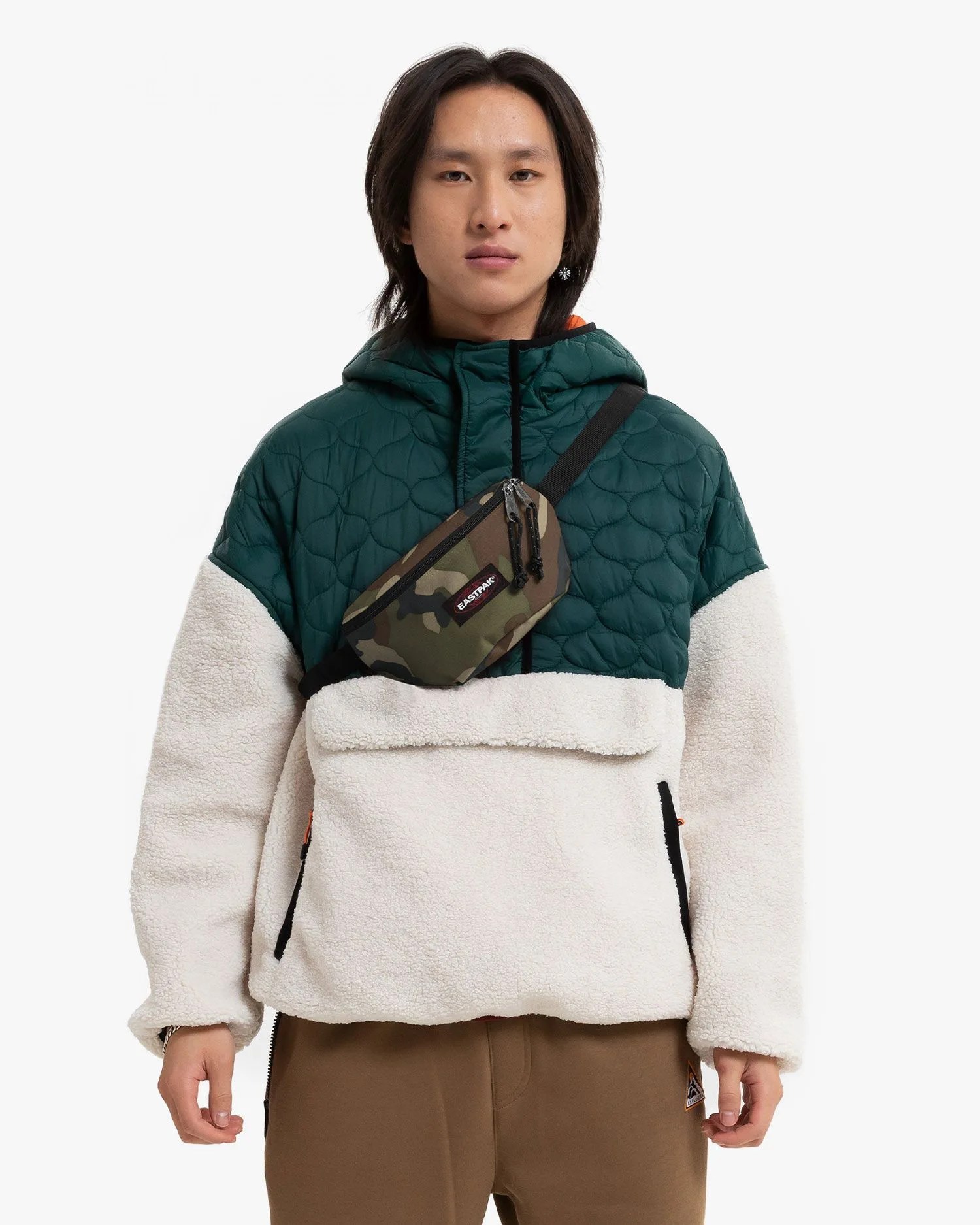 man wearing eastpak fanny pack