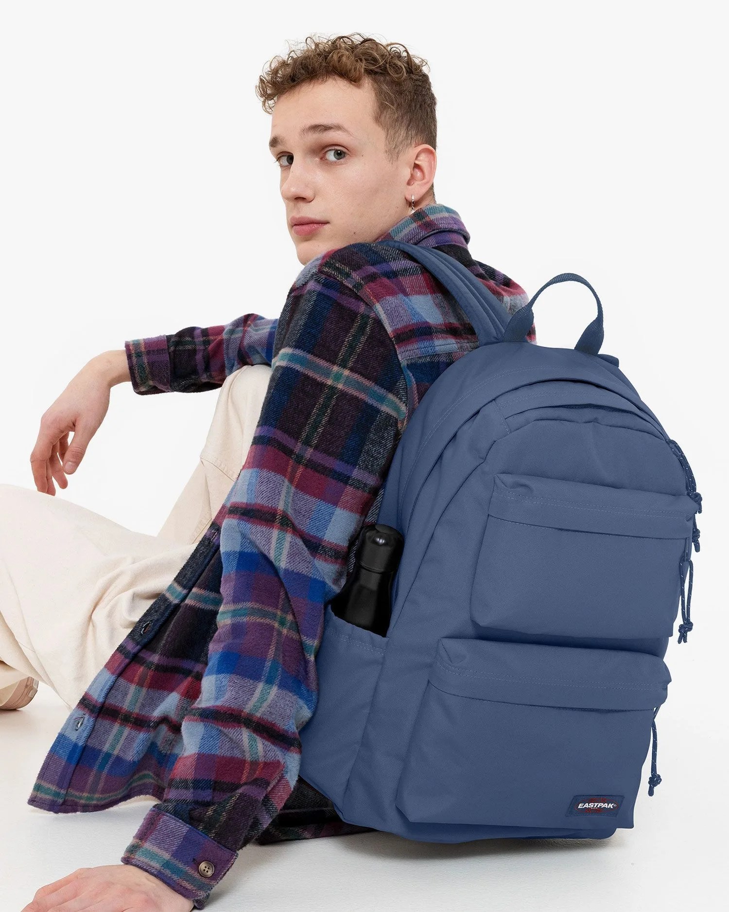 man wearing eastpak backpack