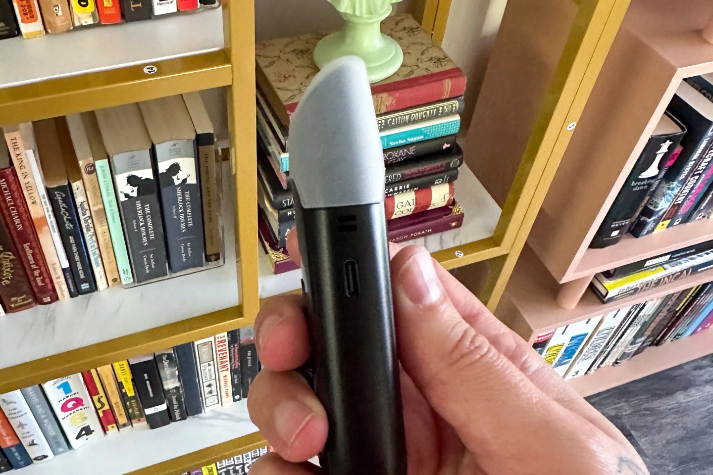 a person holding a vape