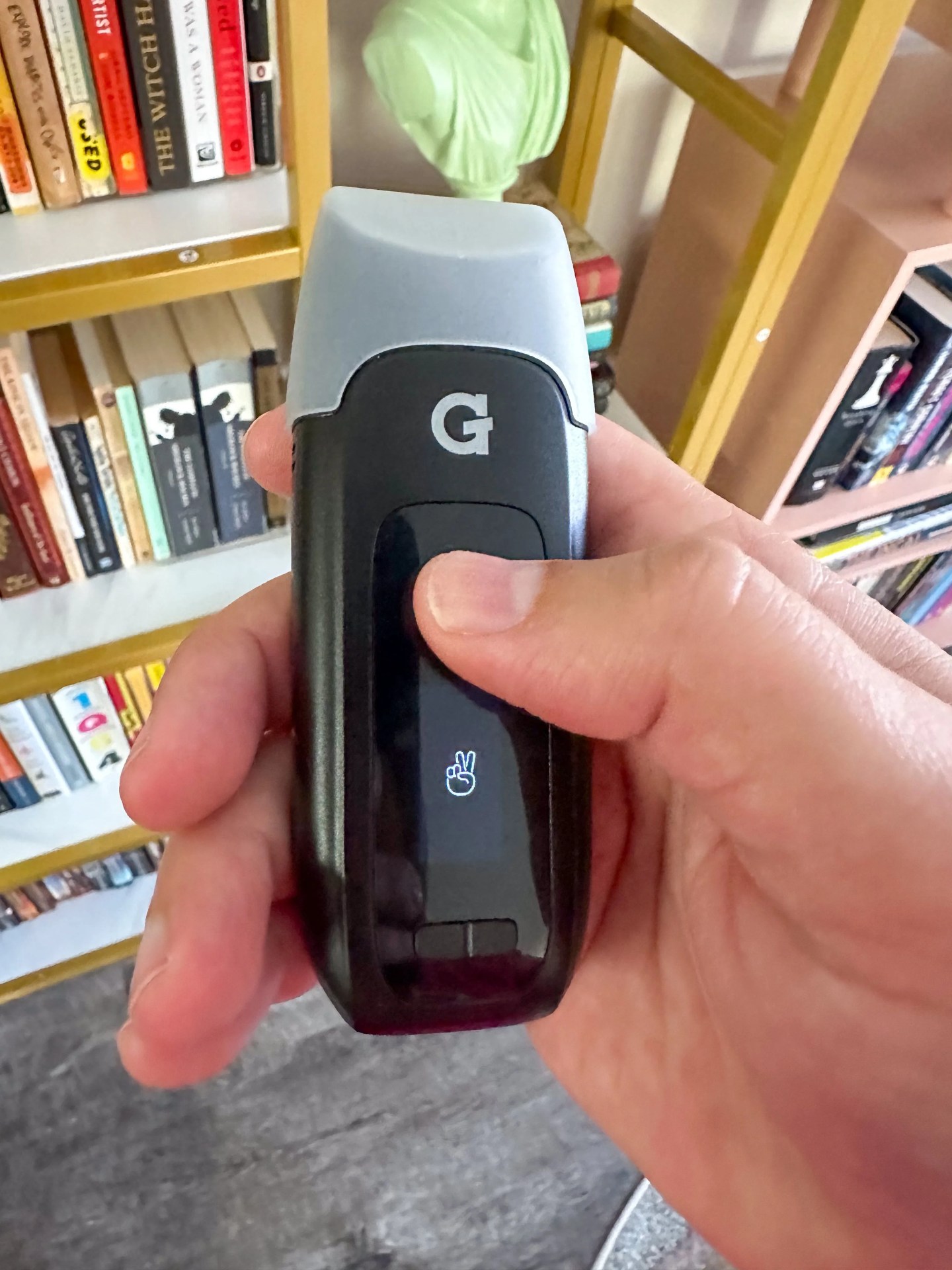 a person holding a vape pen