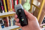 a person holding a g pen dash plus vape