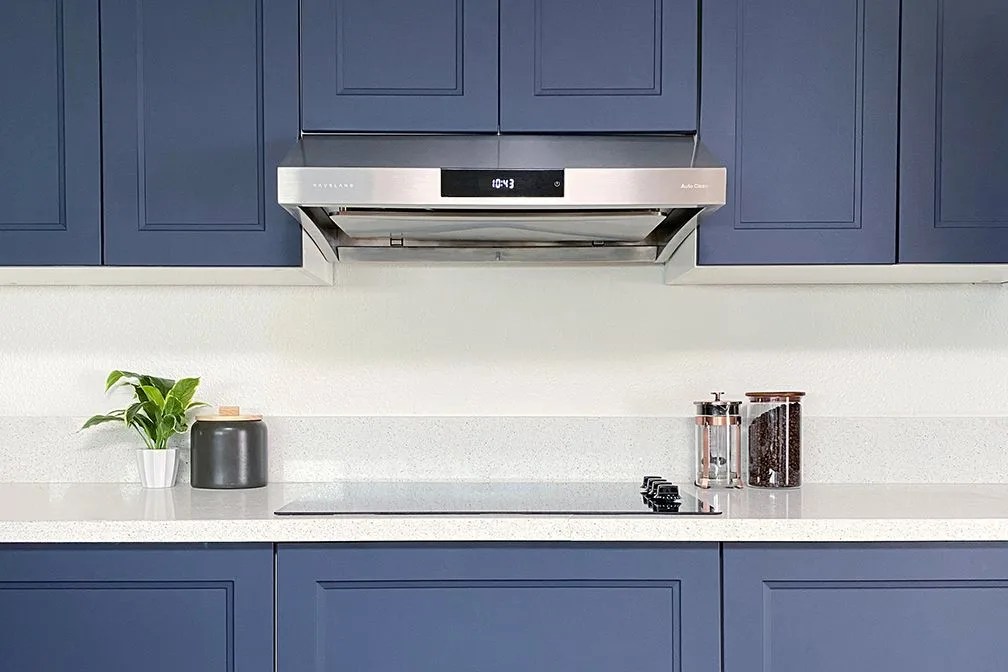 a kitchen with blue cabinets