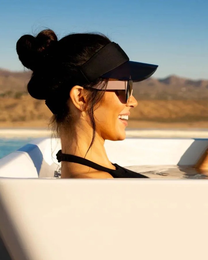 a woman sitting in plunge bathtub