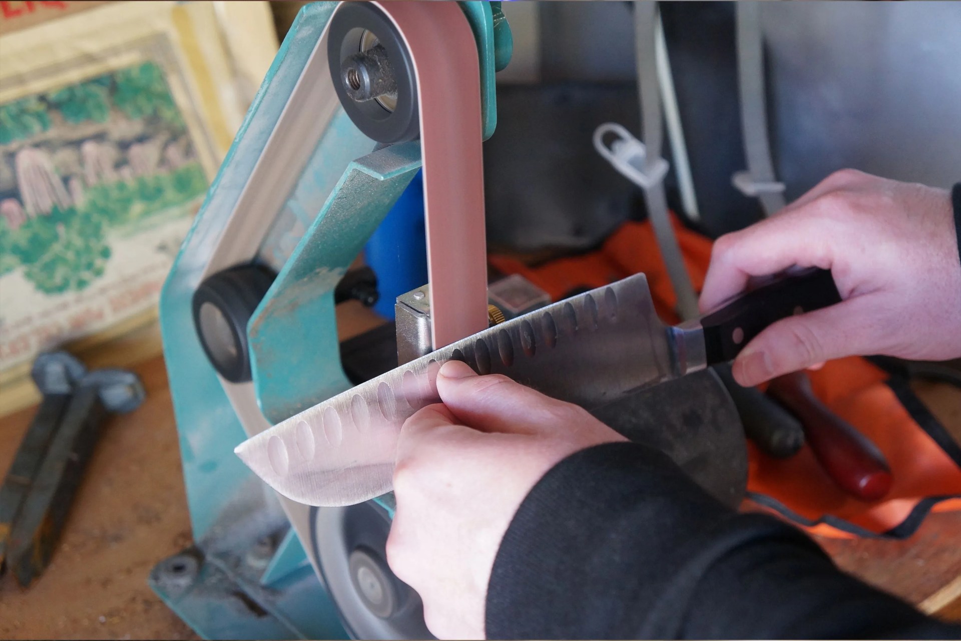 a person sharpening a knife