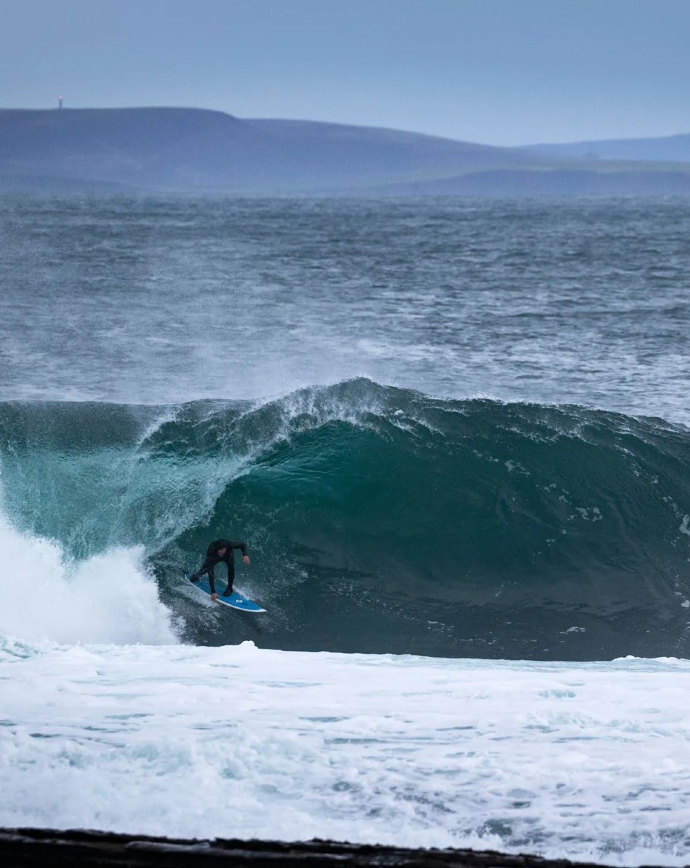 a person surfing on the waves