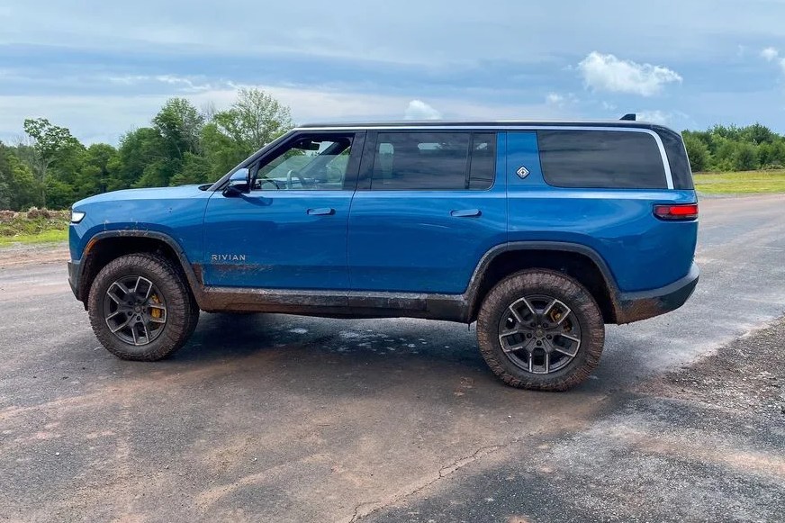 a blue car on a road