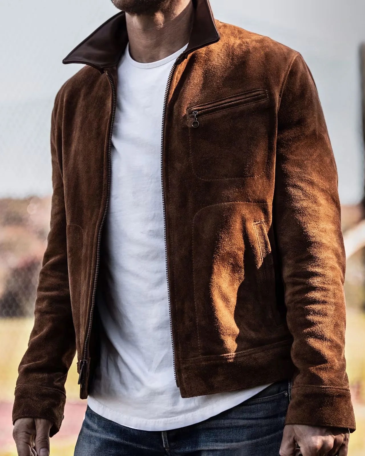 a man wearing schott nyc the roughout leather rancher jacket