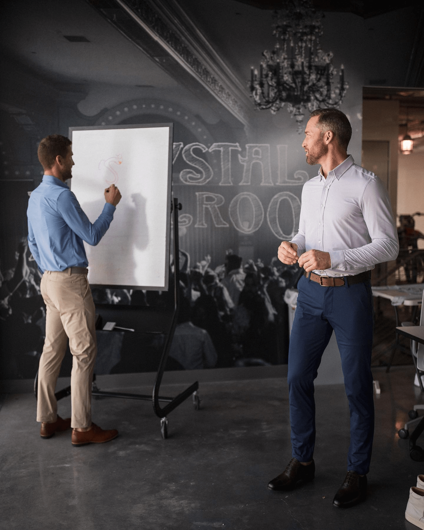 men standing in front of a whiteboard