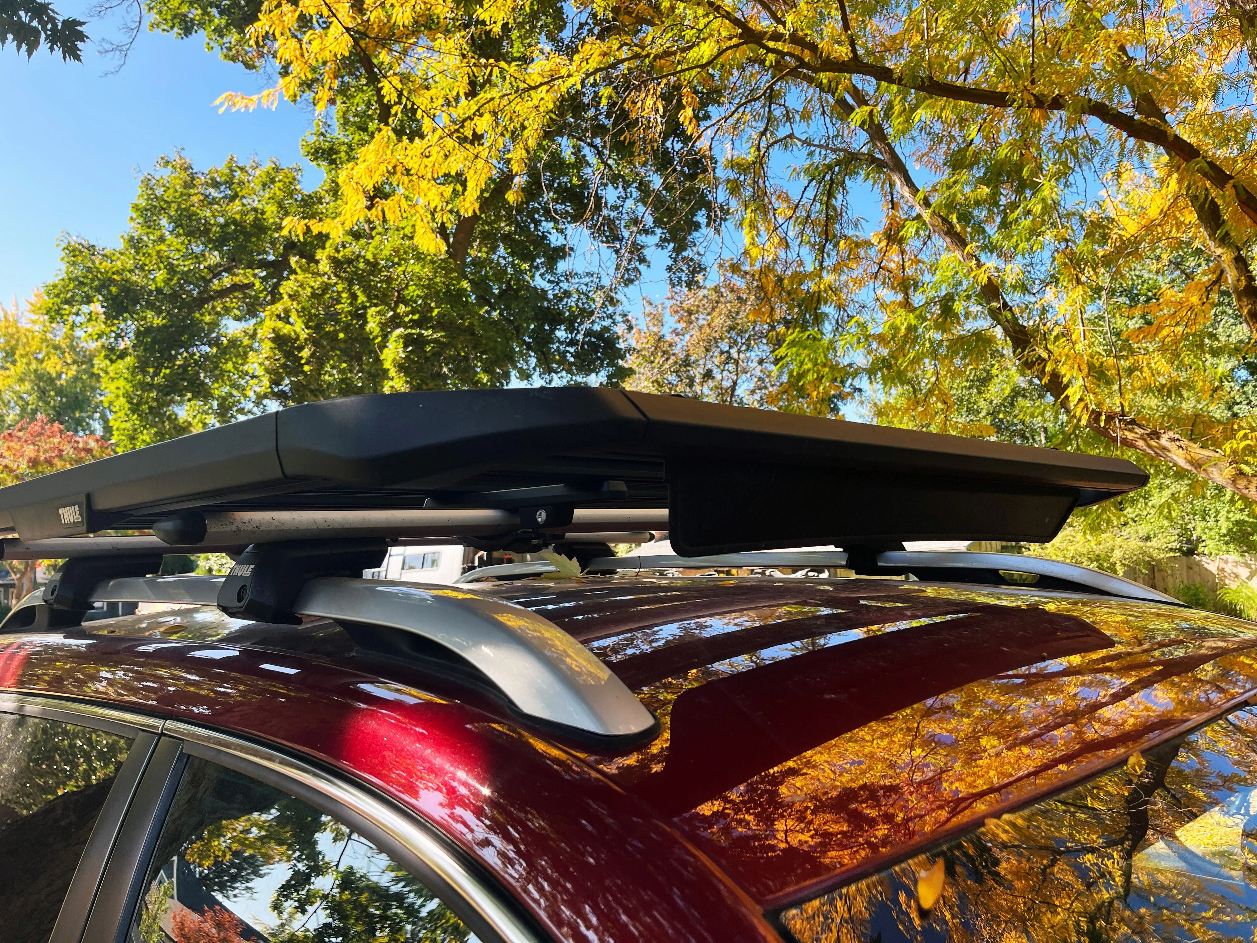 thule roof rack on a red jeep