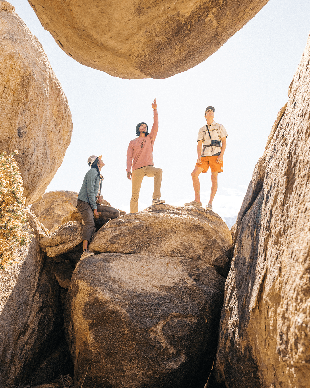 a group of people standing on rocks
