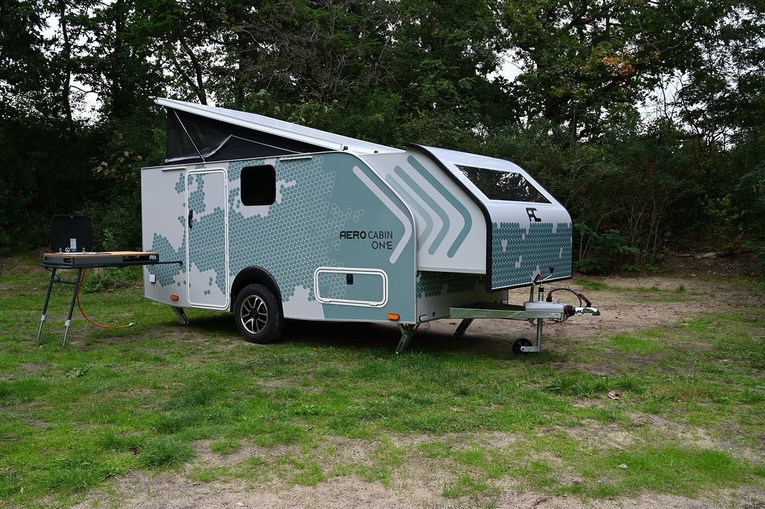 a camper parked in a grassy area