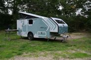 a camper parked in a grassy area