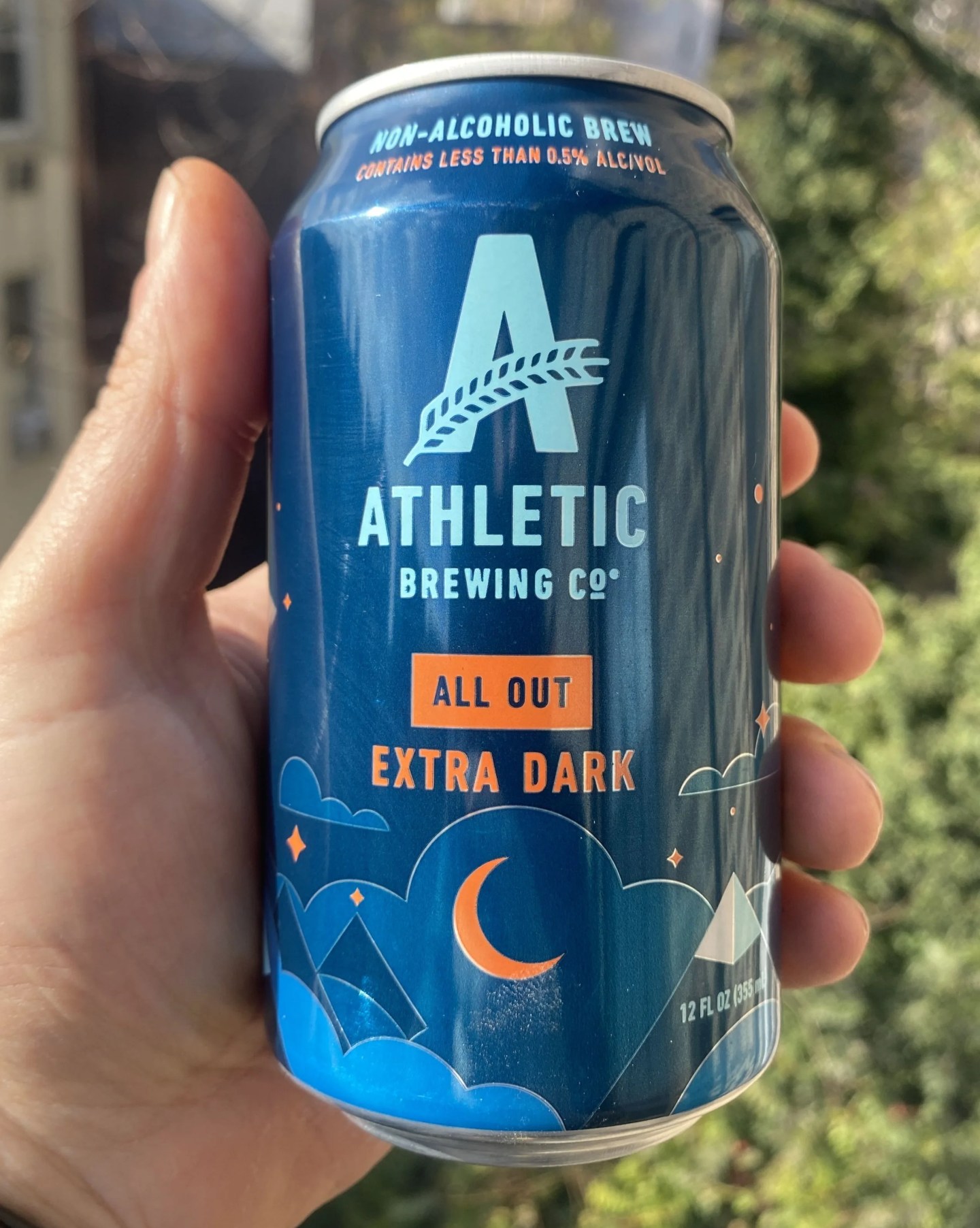 can of beer in hand