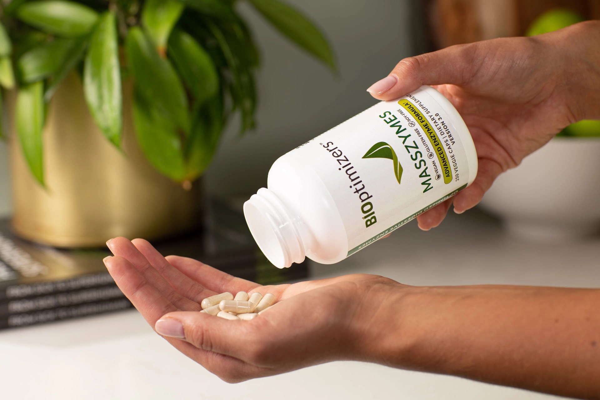 a person holding a bottle of bioptimizers medicine