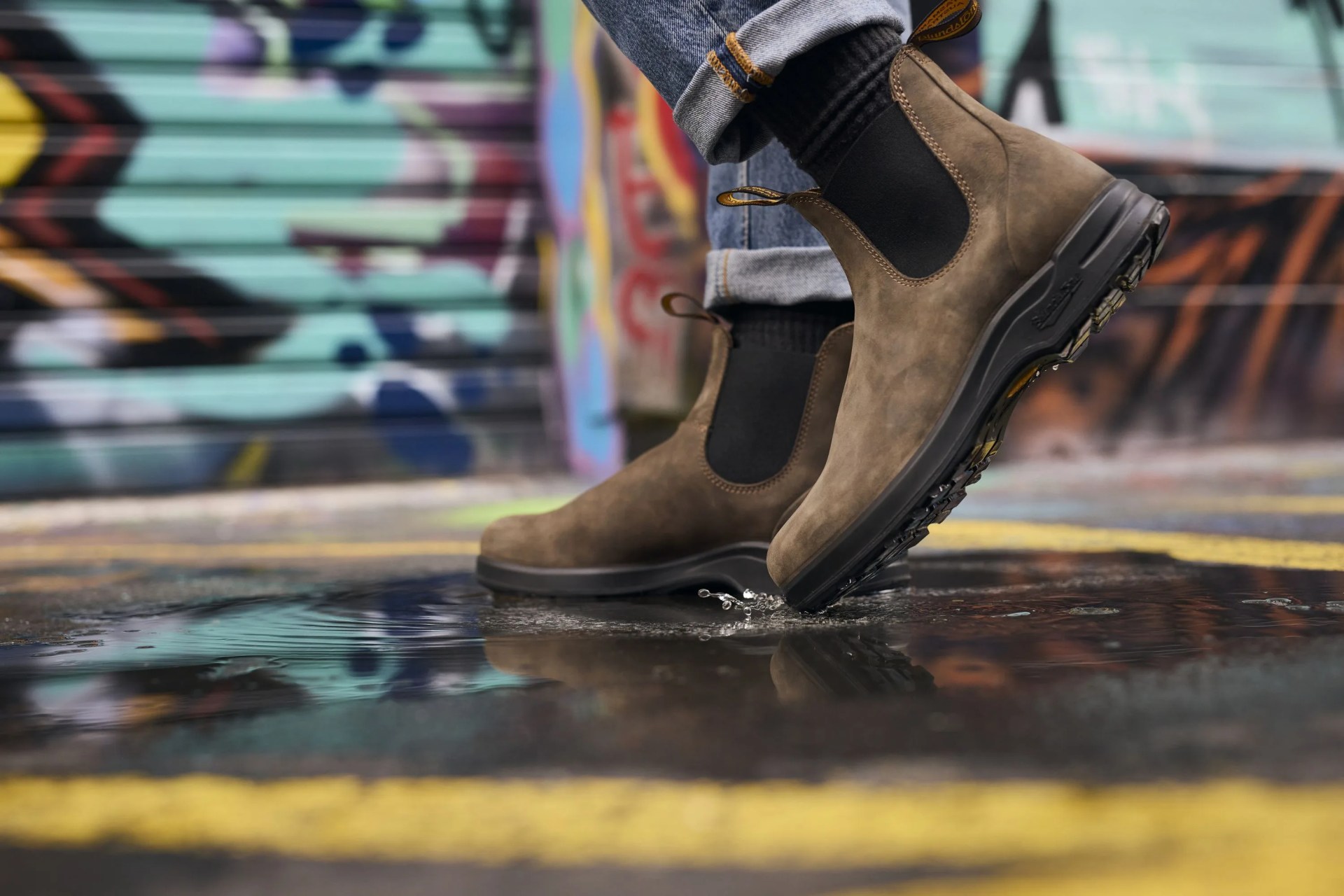a person wearing blundstone boots