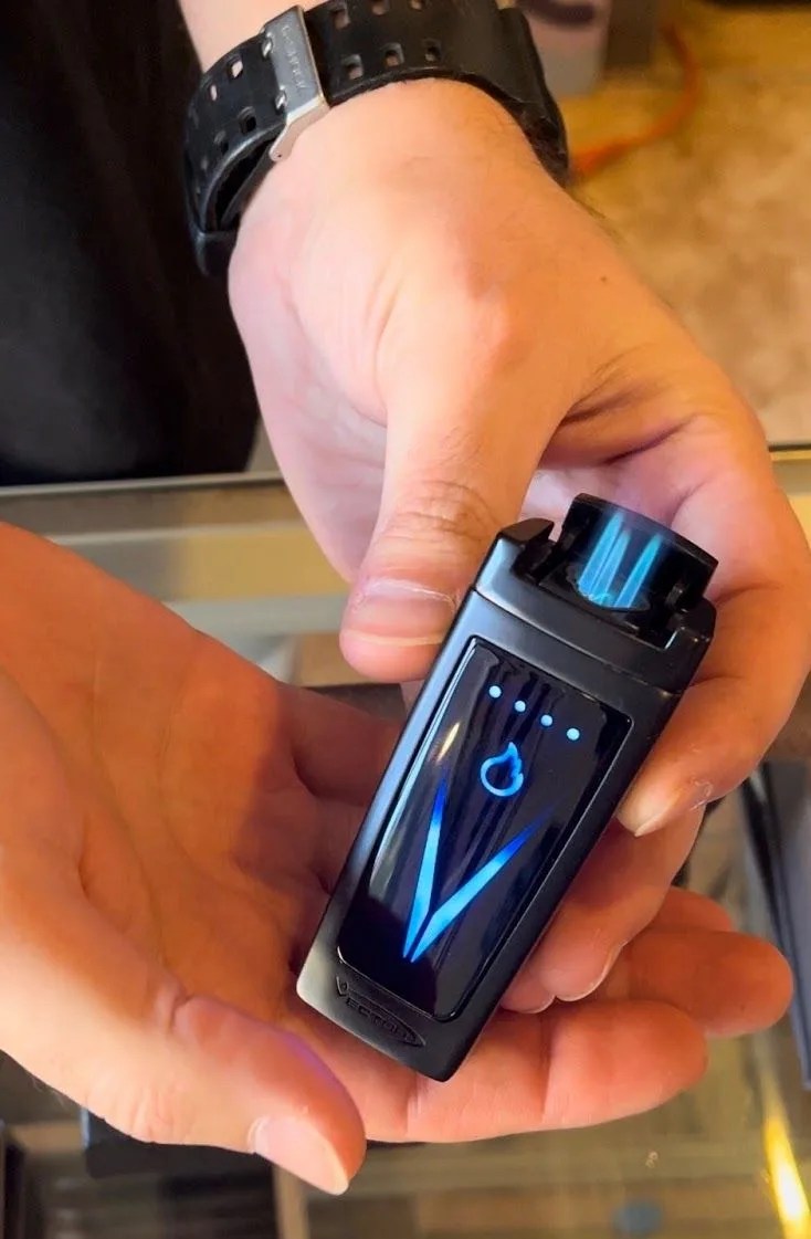 a person holding a lighter