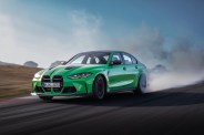 a green car on a road