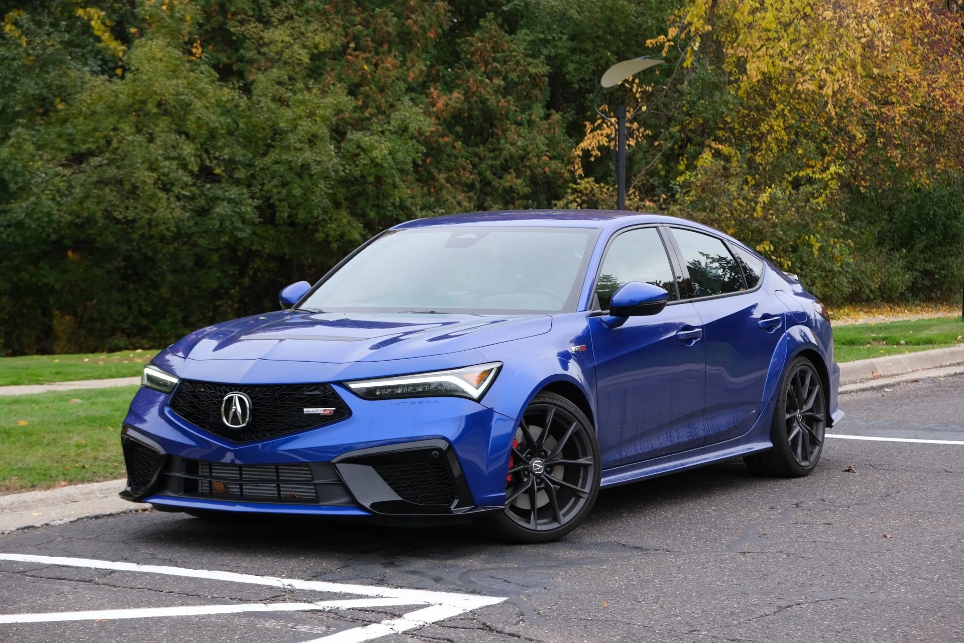 a blue car parked in a parking lot