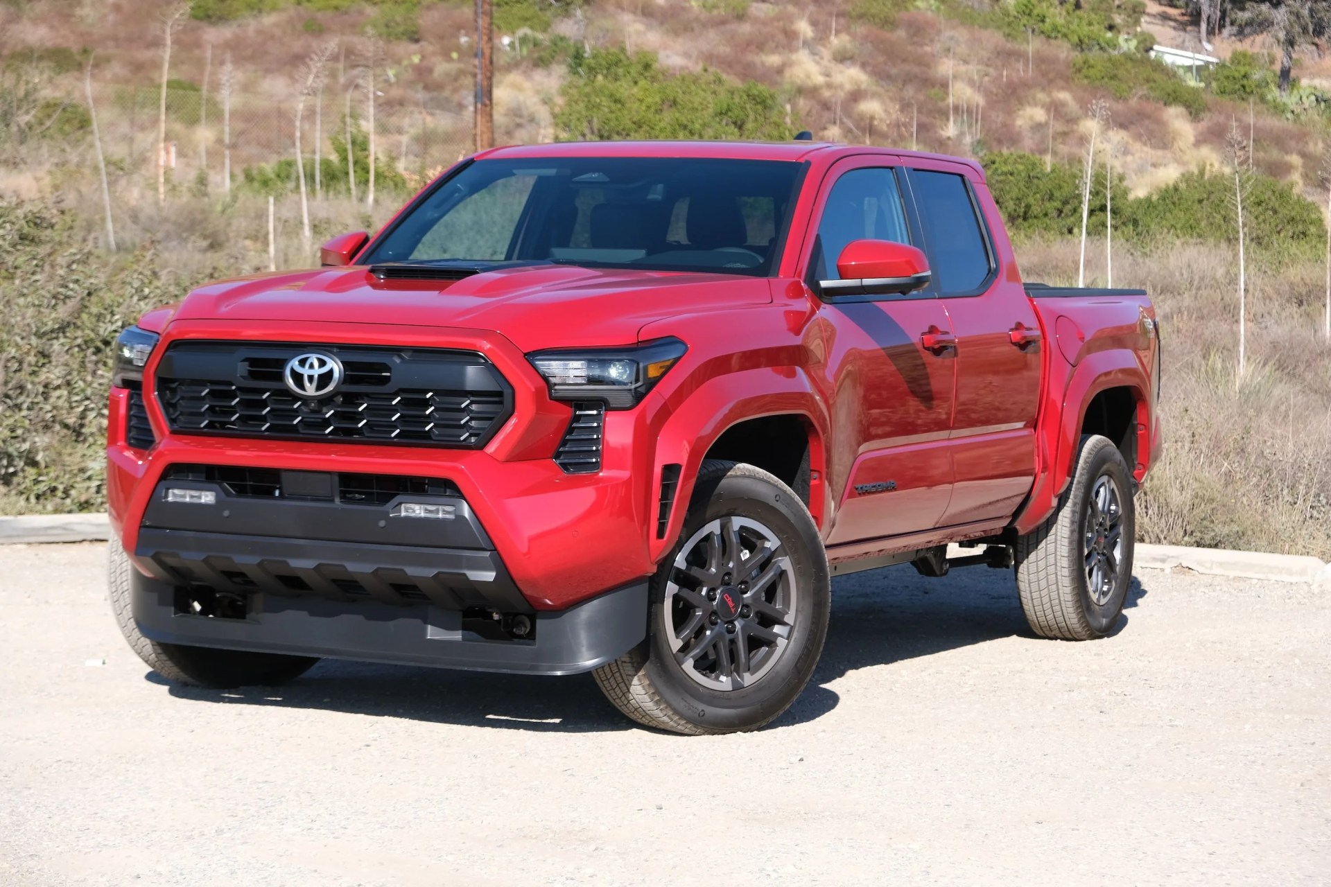 2024 toyota tacoma in a beach parking lot