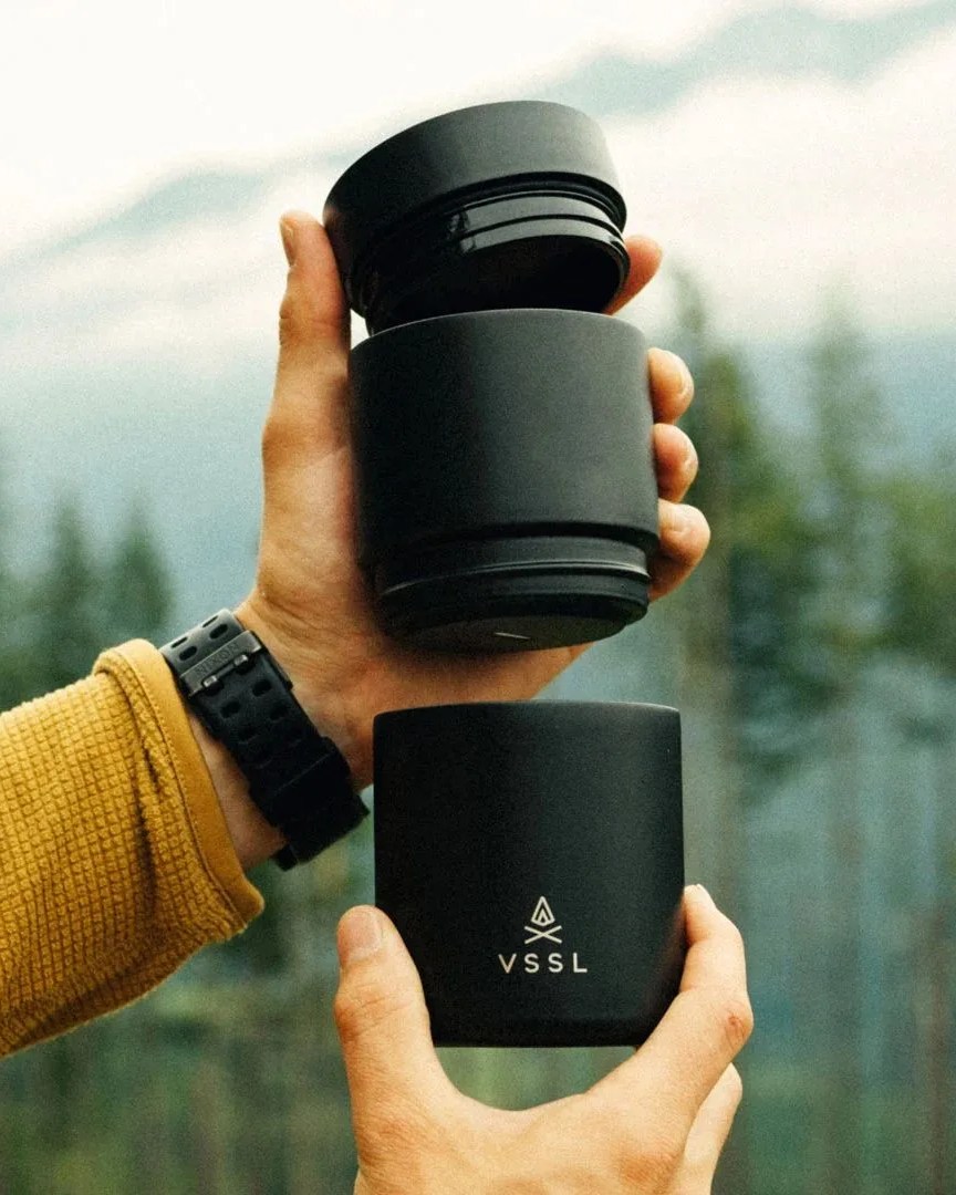 a person holding a vssl nest pour over set