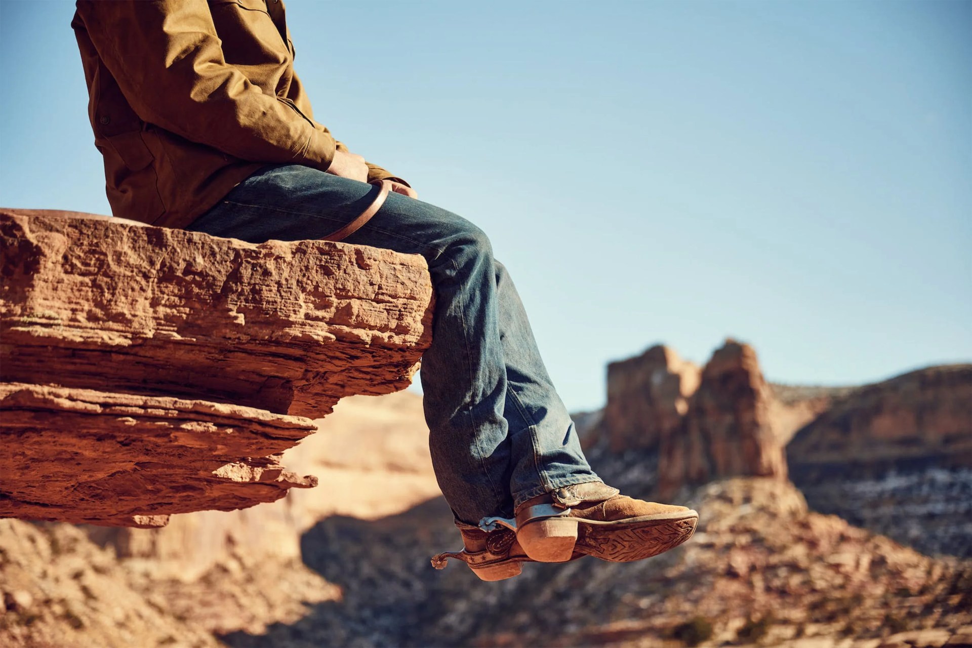 a man sitting on a rock