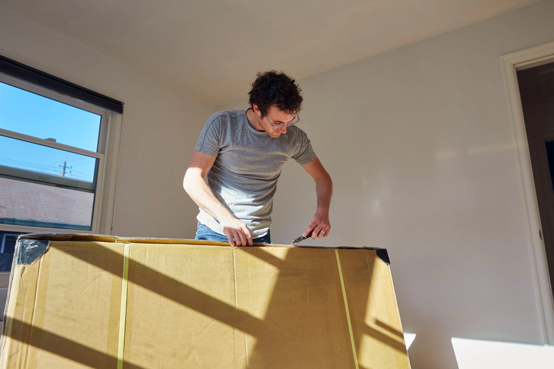 a man unpacking a box