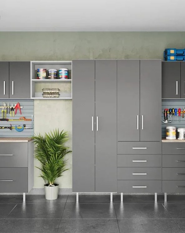 a garage with a plant and garage base module shelving