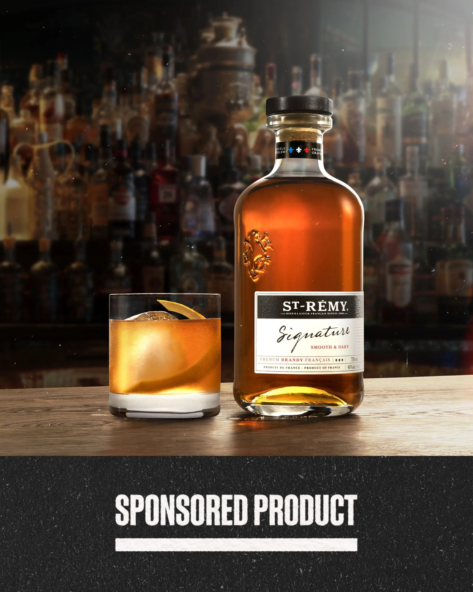 a bottle of alcohol and a glass on a bar
