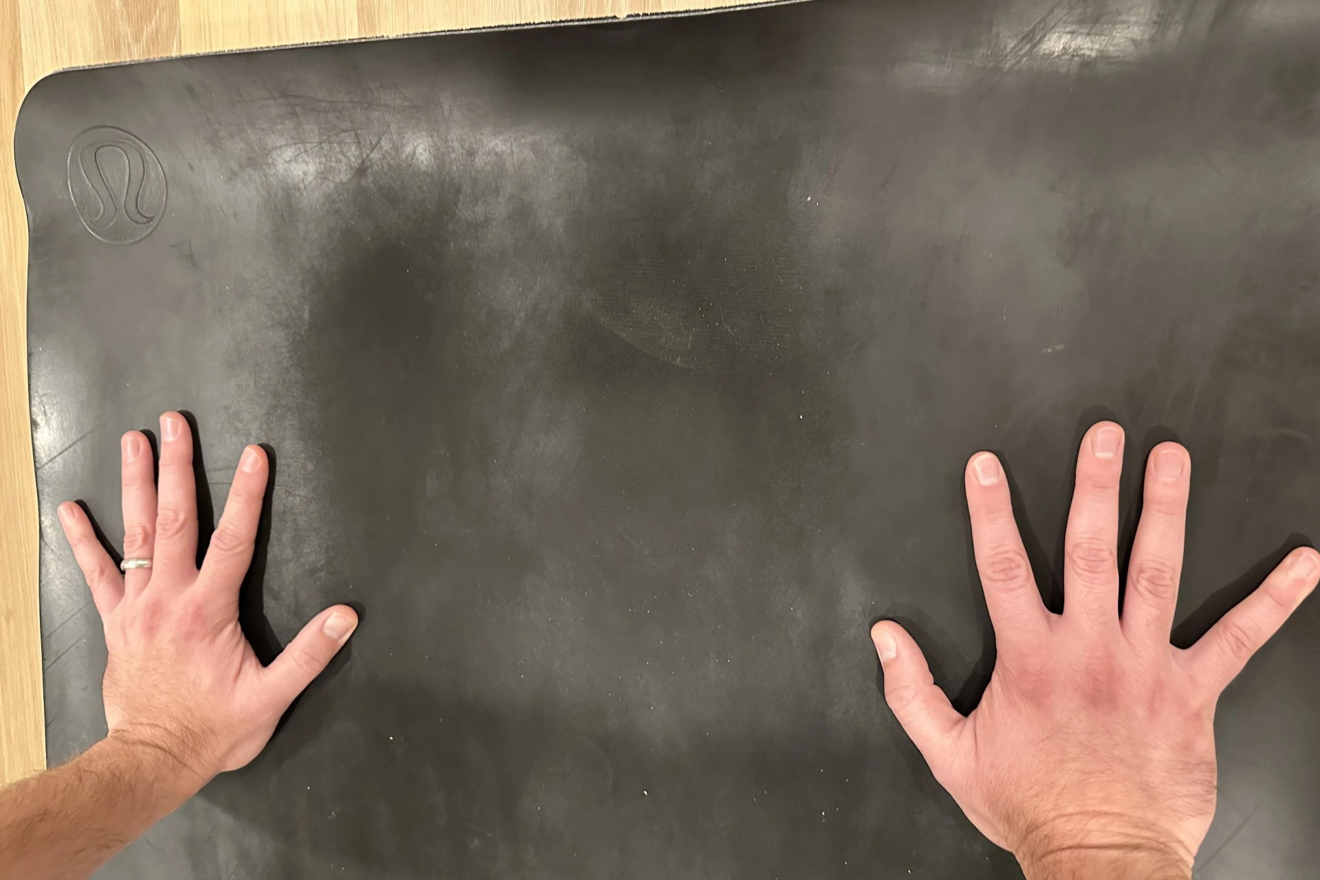 hands on a yoga mat