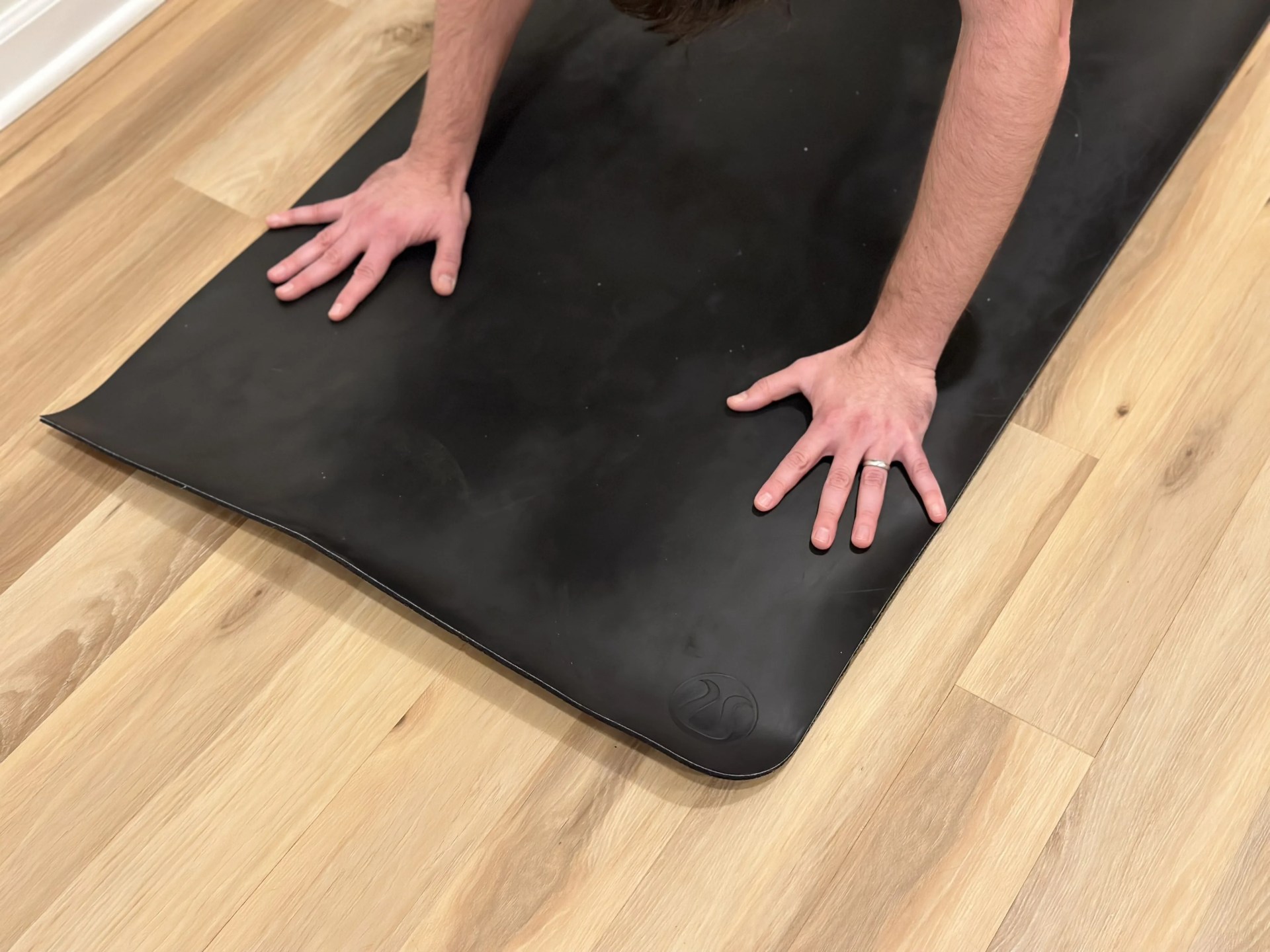 a person's hand on a black rectangular object