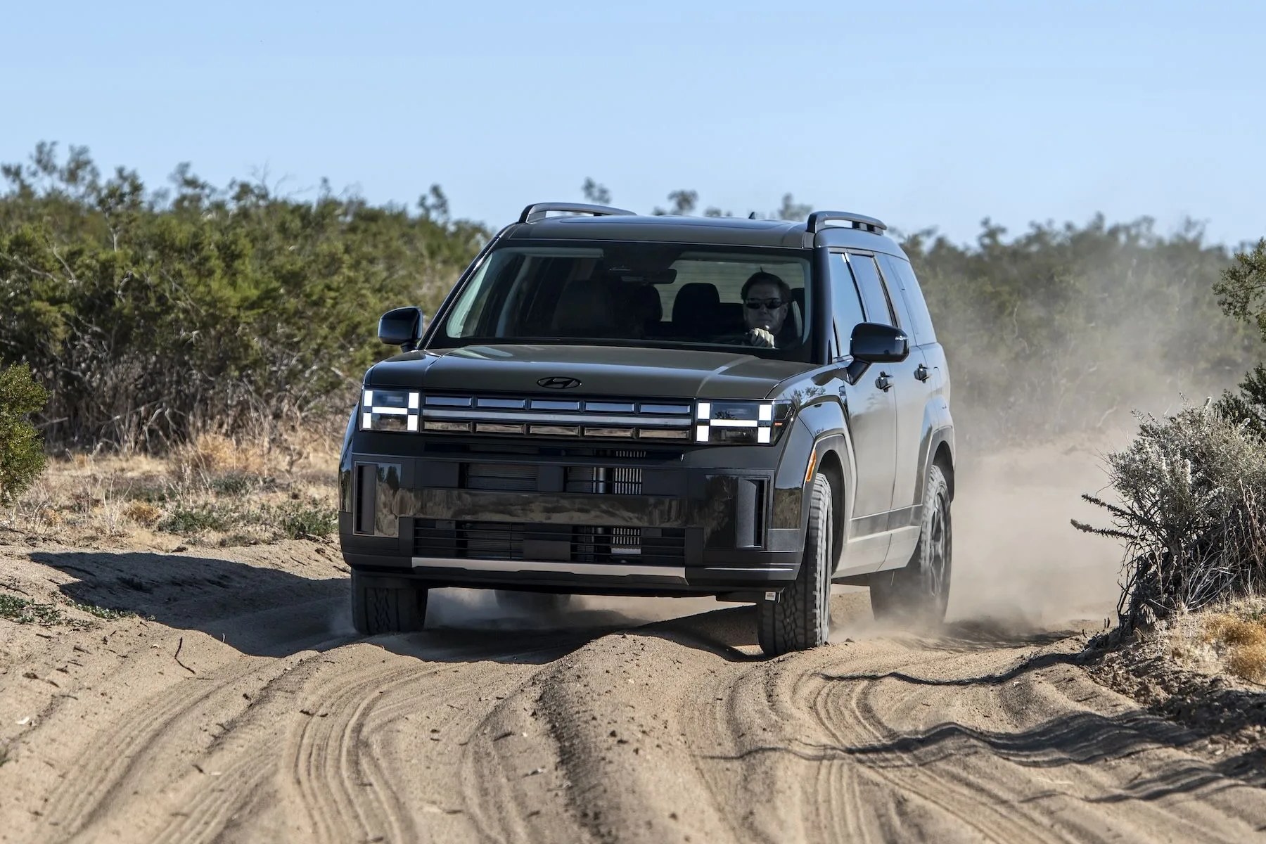 a car driving on a dirt road