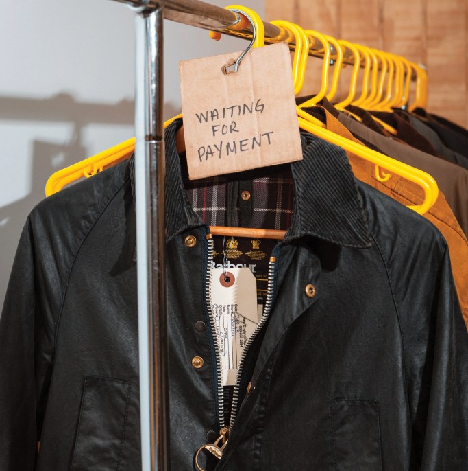 jackets hanging on a rack waiting for payment