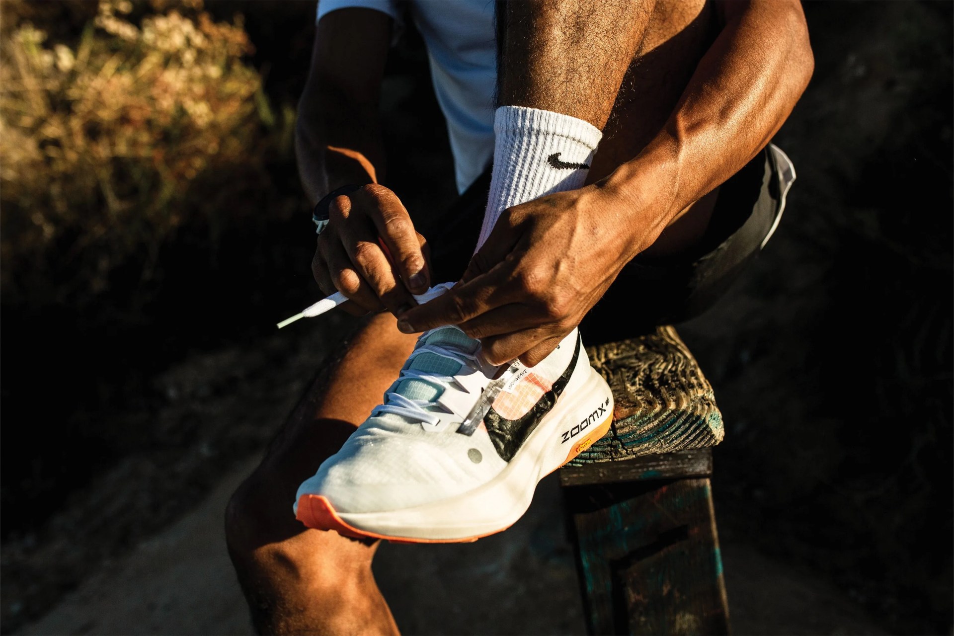 a man tying a shoe
