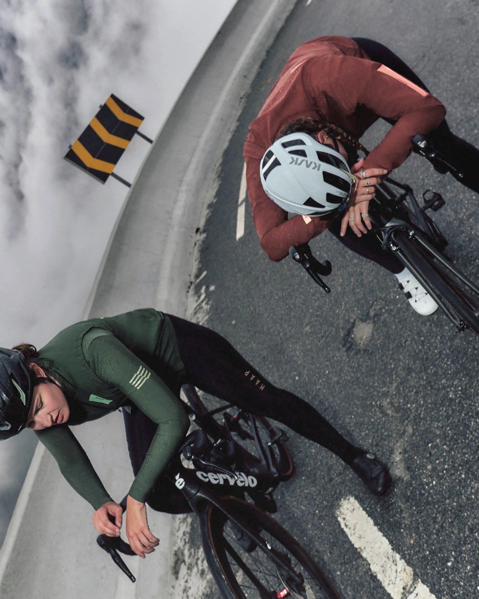 two bikers wearing maap atmos pertex jacket and vest