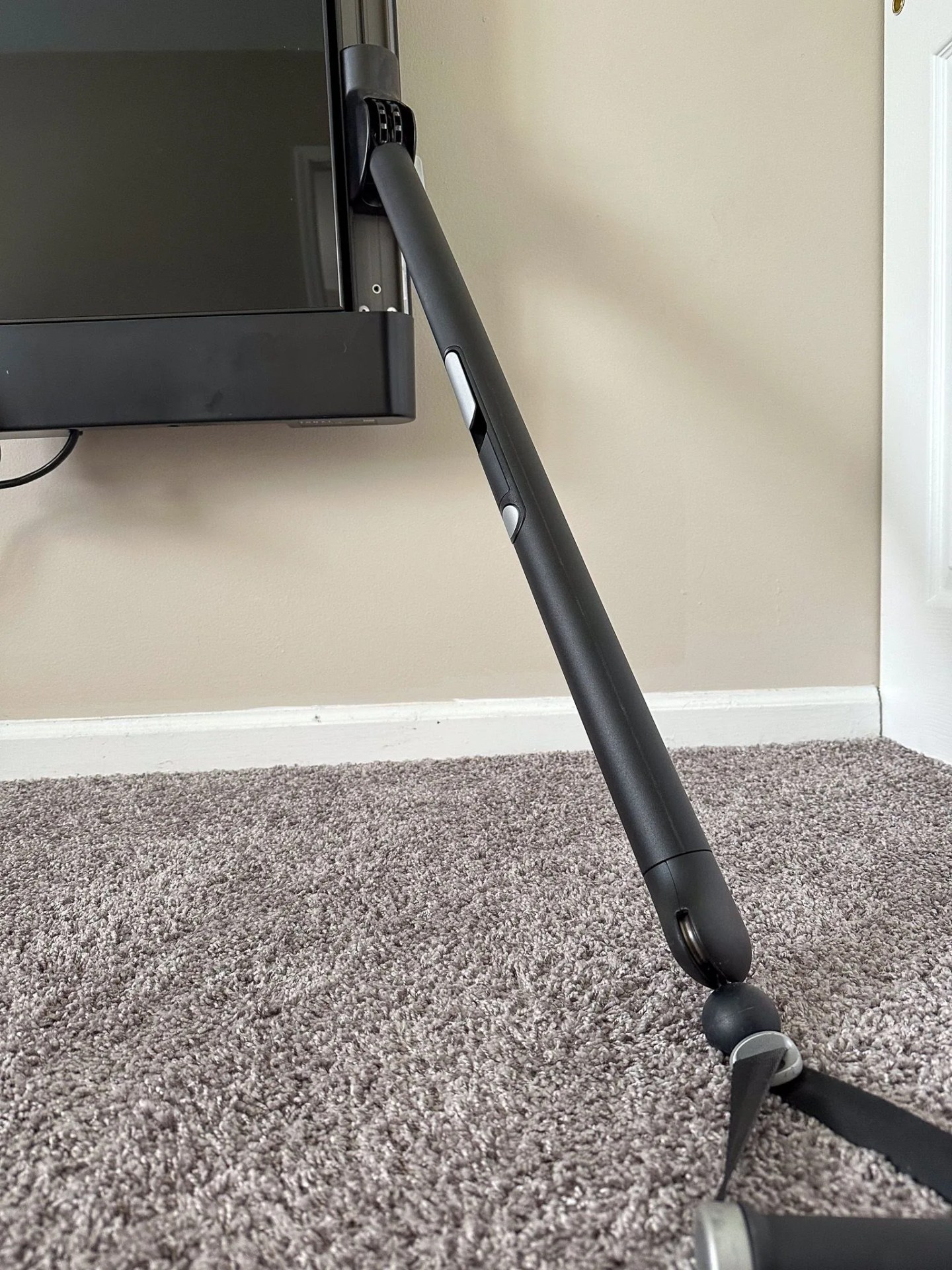 a fitness machine mounted on a wall too close to the ground