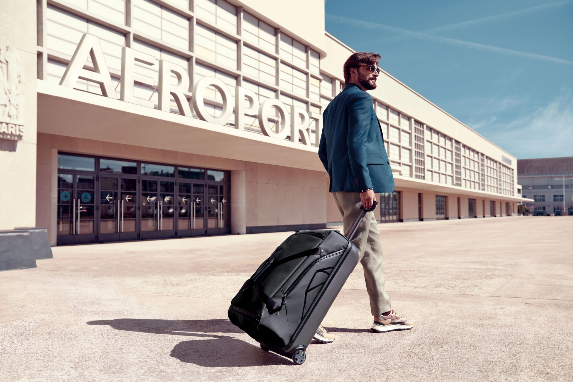 a man with a suitcase at airport