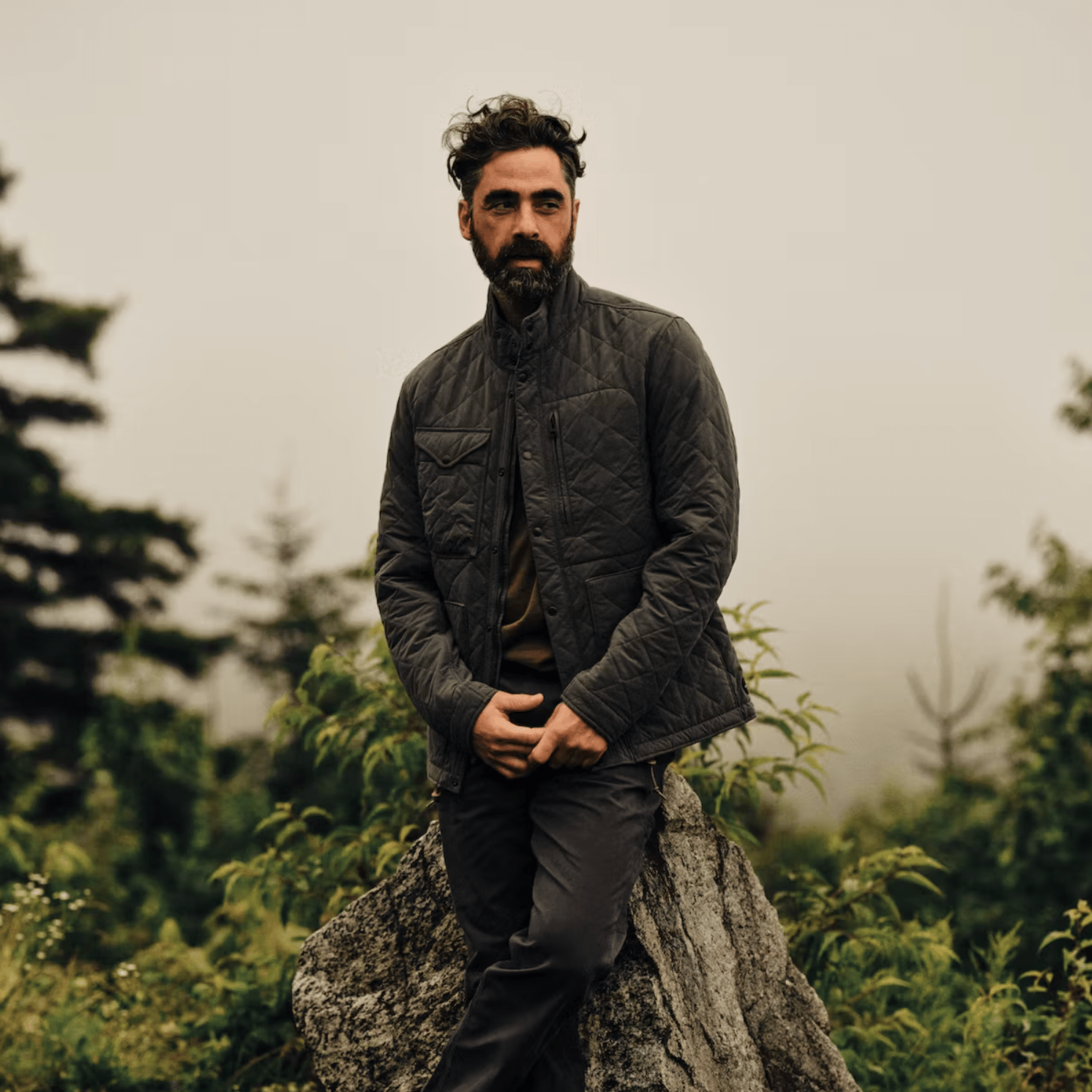 a man standing on a rock