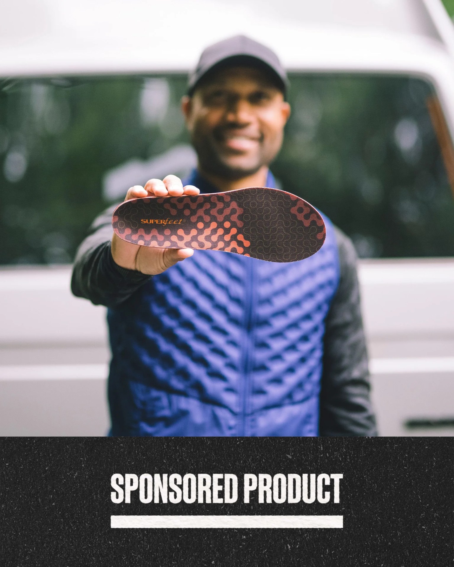 sponsored product a person holding a shoe with superfeet insert