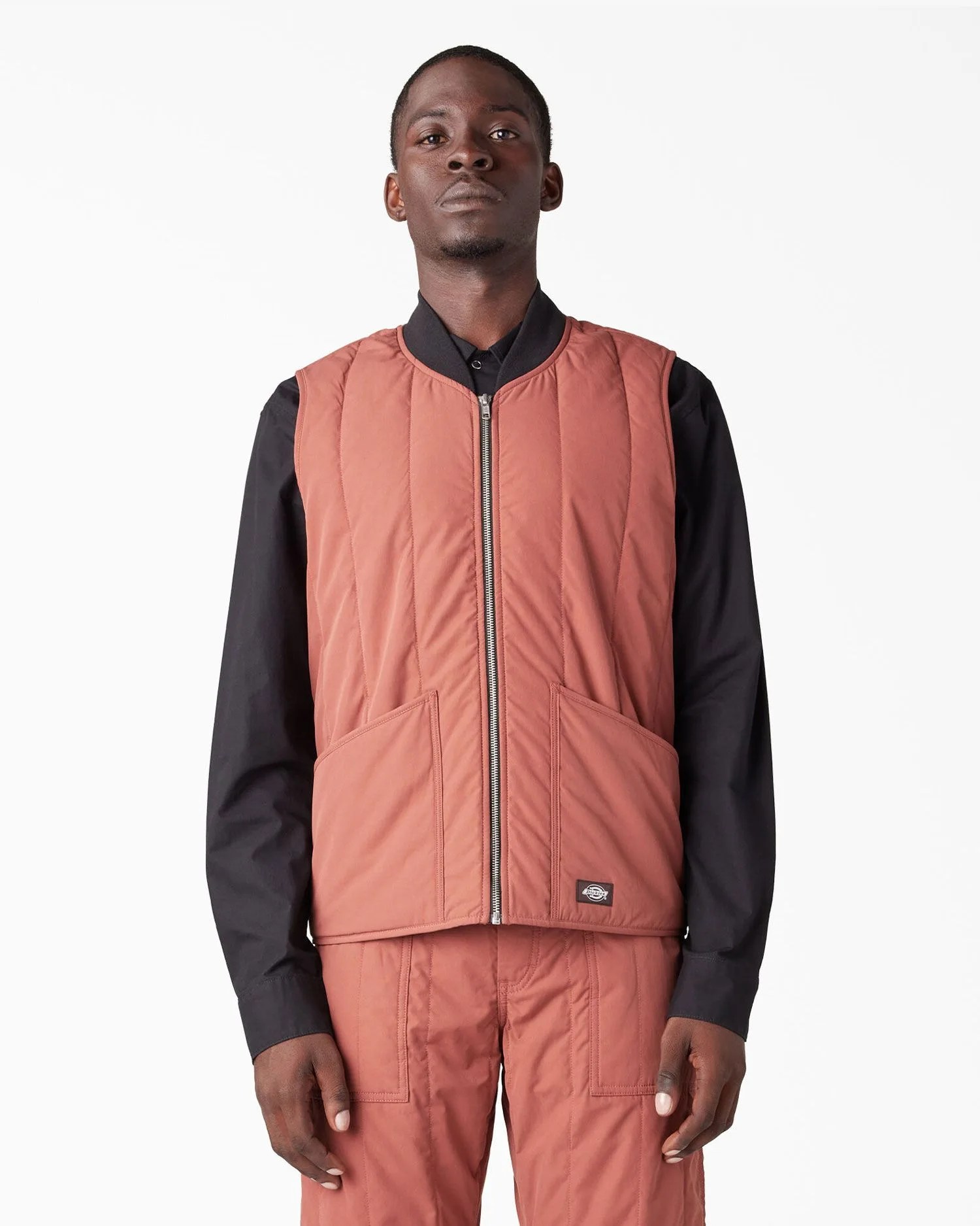 a man wearing dickies premium collection quilted vest