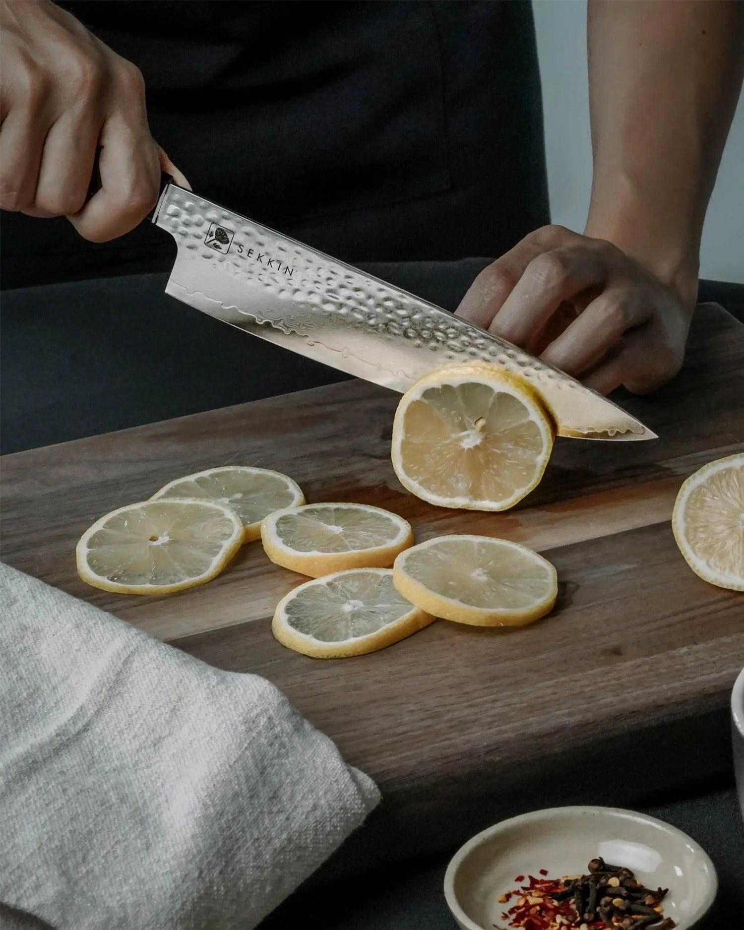 a person cutting a lemon