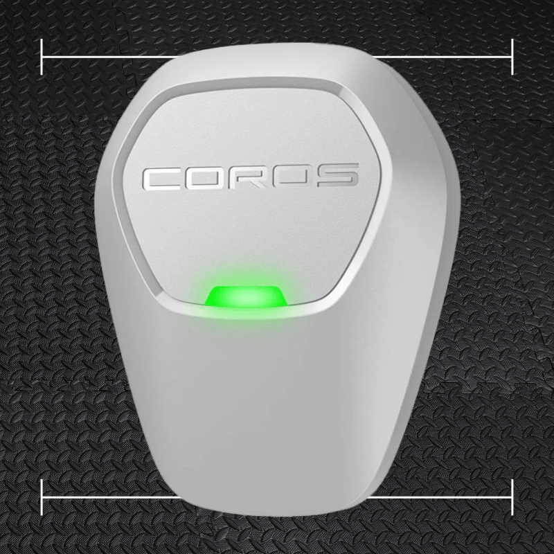 a white rectangular device with a green circle on it